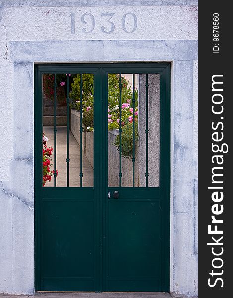 An old door that leads to a house in Madeira Portugal