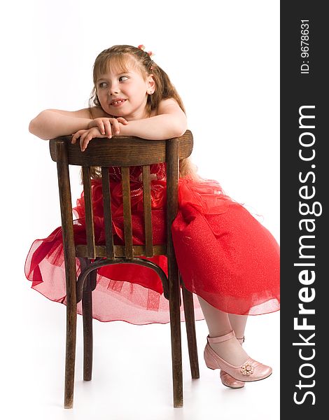 An image of nice girl on brown chair. An image of nice girl on brown chair