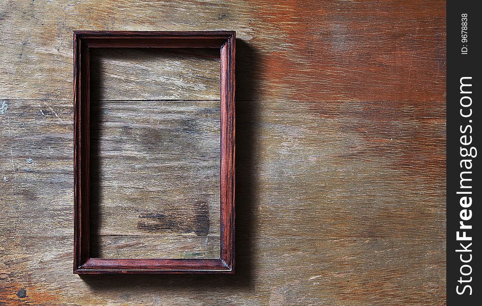 Empty photo-frame on wooden background. Empty photo-frame on wooden background