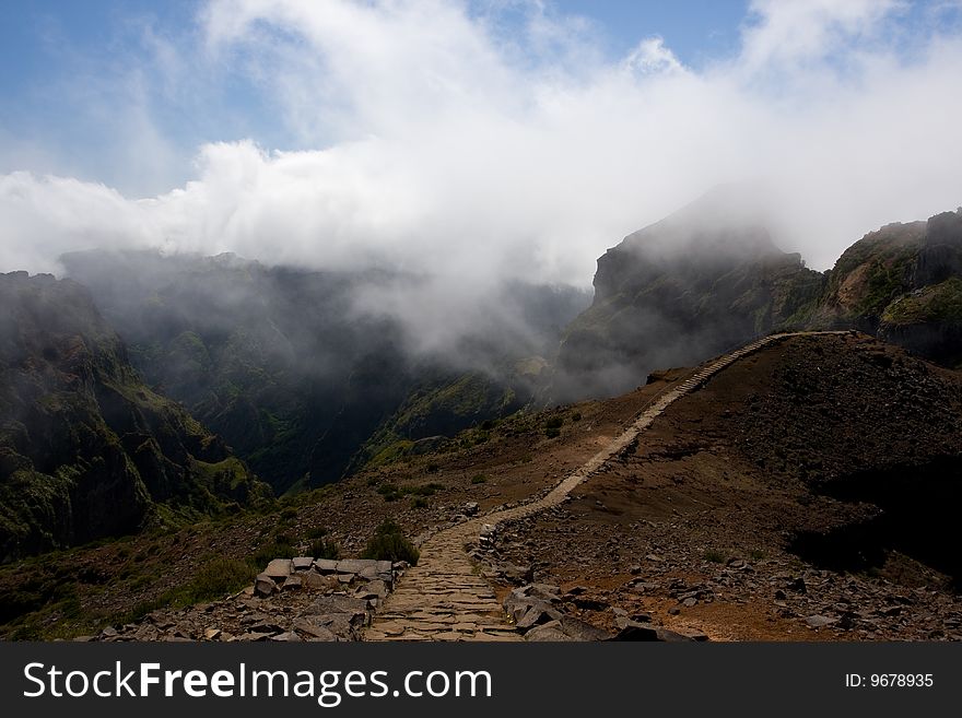 A path that leads to the mountains. This picture is taken in Madeira Portugal. A path that leads to the mountains. This picture is taken in Madeira Portugal