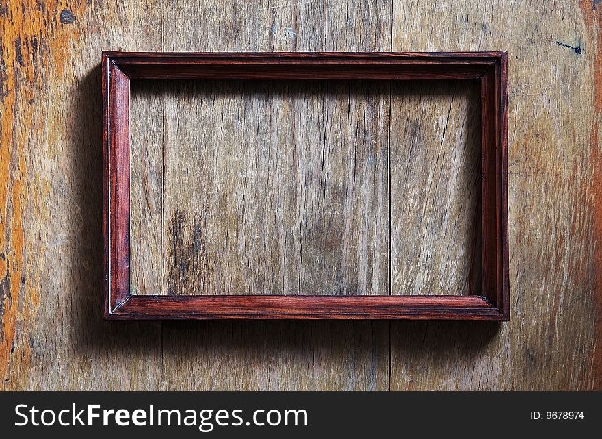 Empty photo-frame on wooden background. Empty photo-frame on wooden background