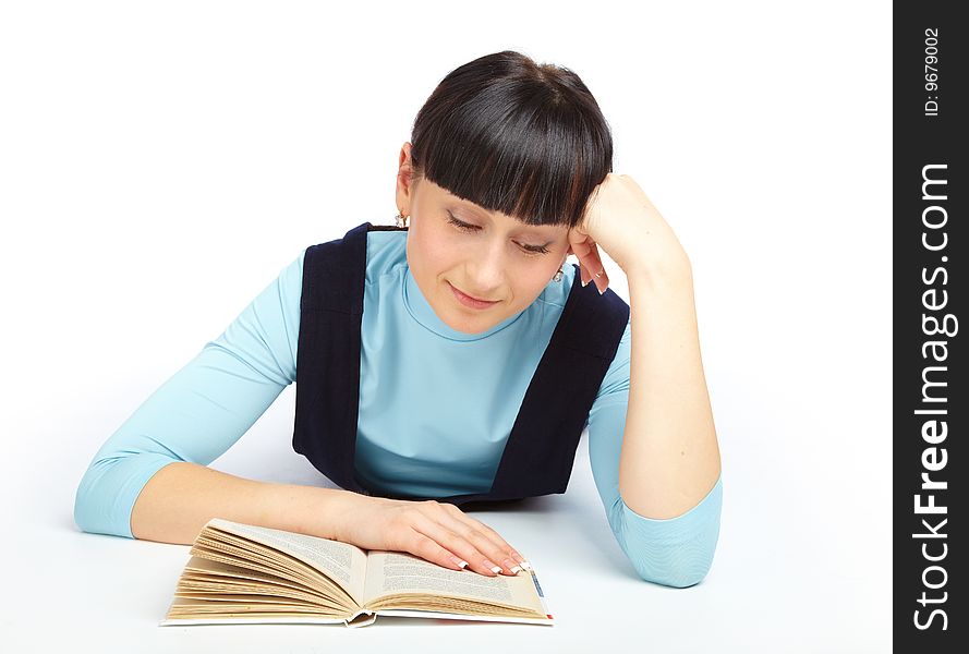 Girl laying on the floor and reading book