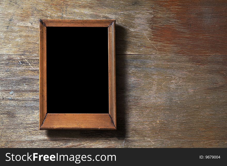 Empty Frame On Wooden Background