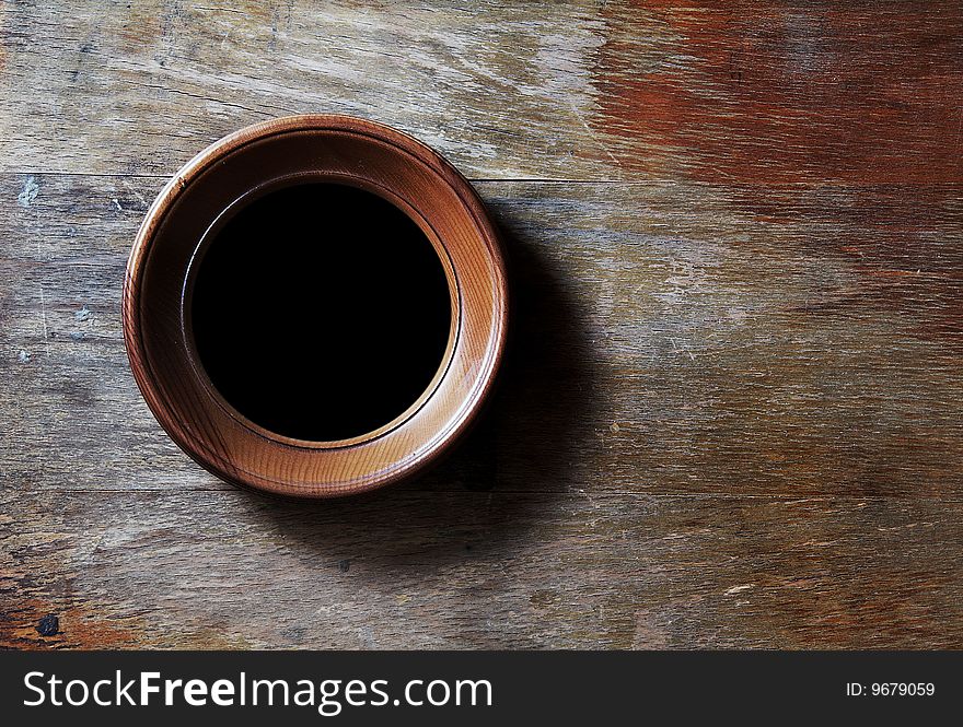 Empty photo-frame on wooden background. Empty photo-frame on wooden background