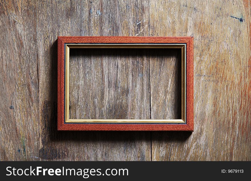 Empty photo-frame on wooden background. Empty photo-frame on wooden background