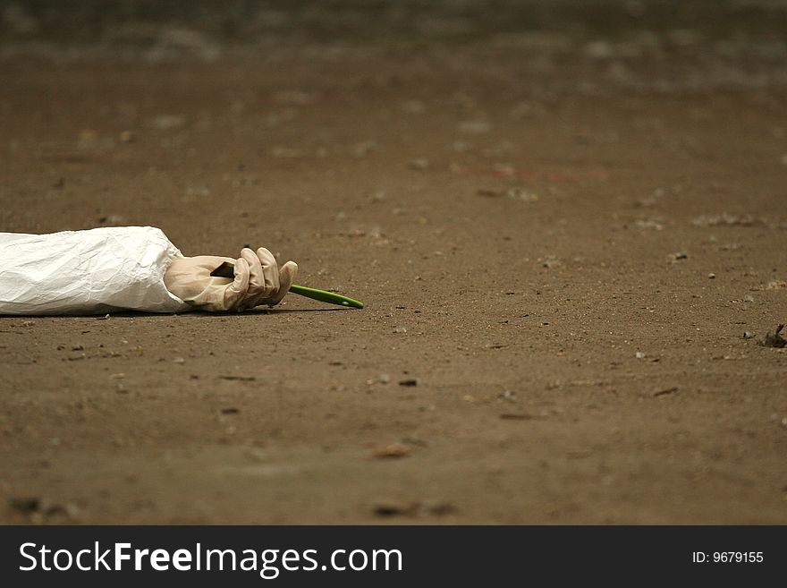 Dead worker lying on the ground with a brush in the hand. Dead worker lying on the ground with a brush in the hand