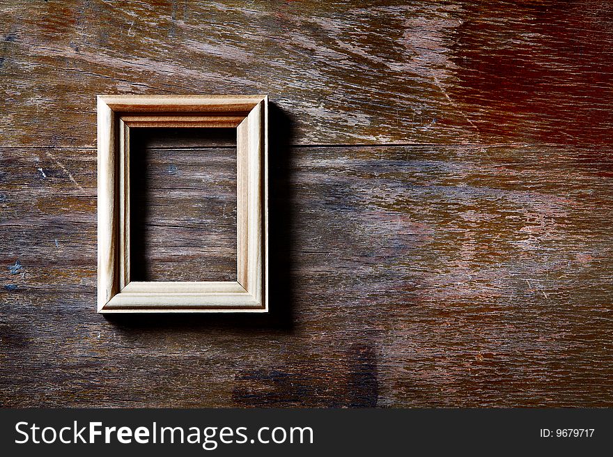 Empty photo-frame on wooden background. Empty photo-frame on wooden background