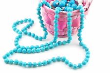 Colored Pearl Beads In Pink Wicker Basket Isolated Stock Images