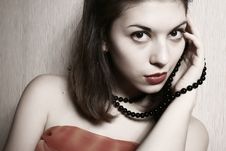 Portrait Of The Young Brunette With A Beads Royalty Free Stock Photo Portrait Of The Young Brunette With A Beads Royalty Free Stock Photo