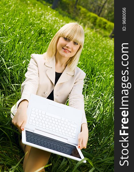 Happy young businesswoman with laptop. Happy young businesswoman with laptop