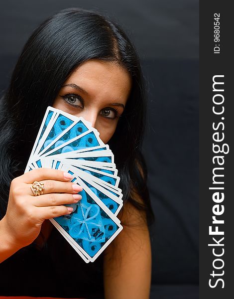 Portrait brunette girl with cards