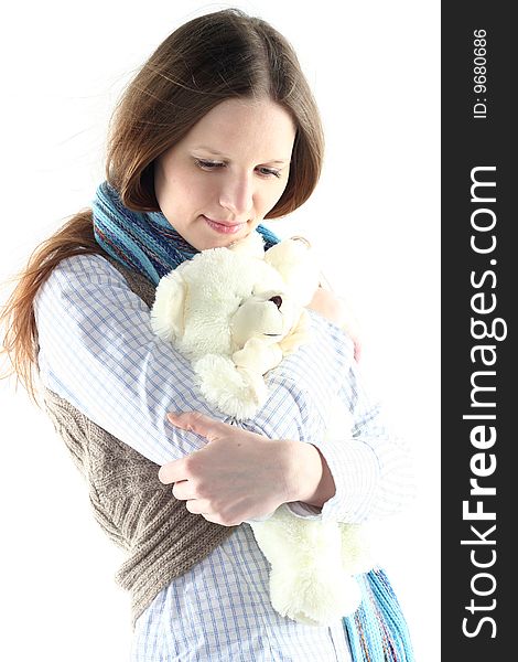 Portrait of young woman with teddy bear isolated on white background