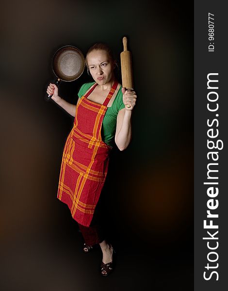 Woman with kitchen tools - as angry wife