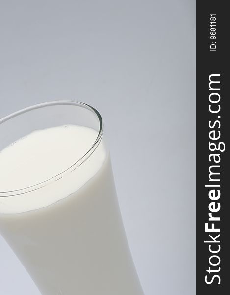 Glass Of Milk On Gray Background