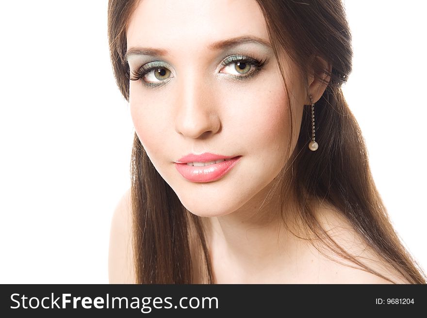 Beautiful young brunette with bright makeup isolated on white background