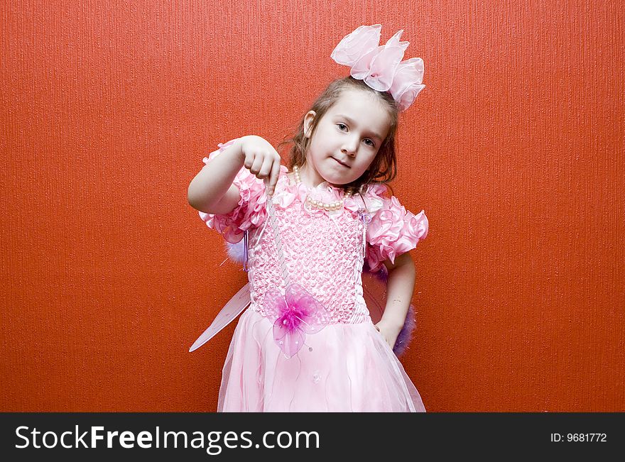 Little Girl Dressed In Pink With Wings