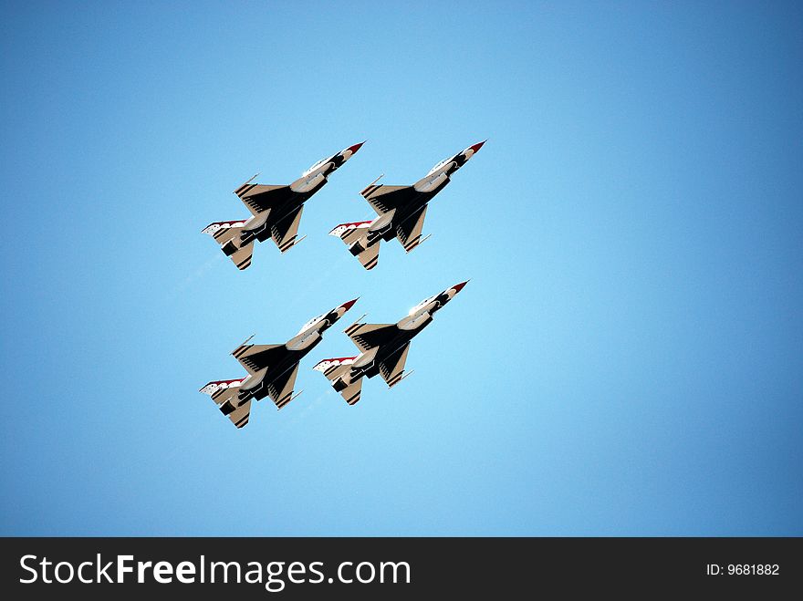 USAF Thunderbirds in formation on a steep vertical ascent. USAF Thunderbirds in formation on a steep vertical ascent