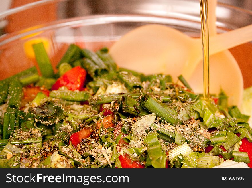 Salad With Herbs Adding Oil