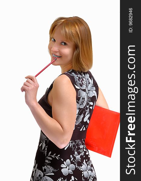 Smiling woman with a pencil in hands (on a light gray background)