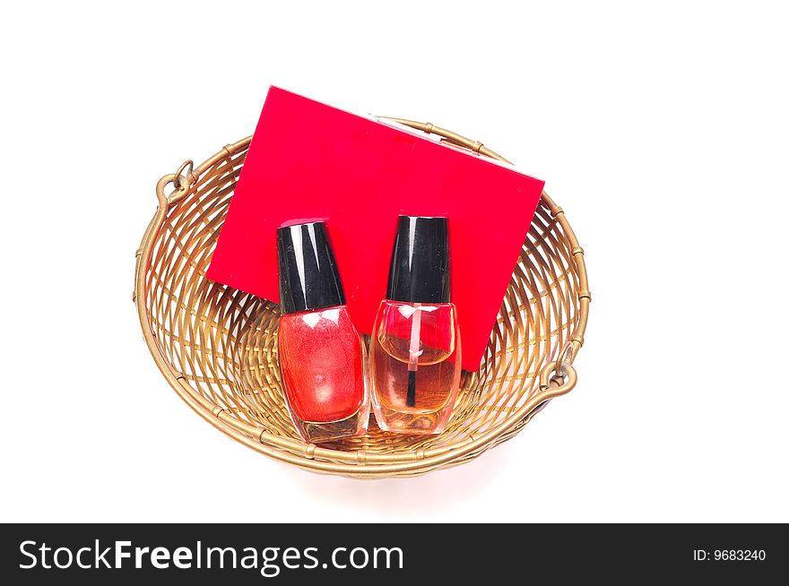 Nail paint bottles and perfume bottle in basket.