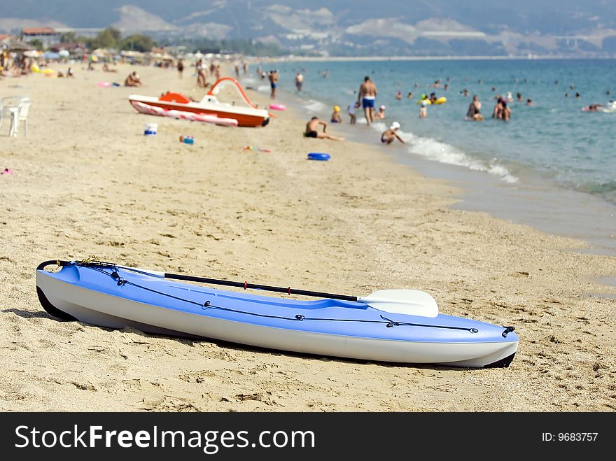 Blue canoe on a sandy beautiful beach. Blue canoe on a sandy beautiful beach