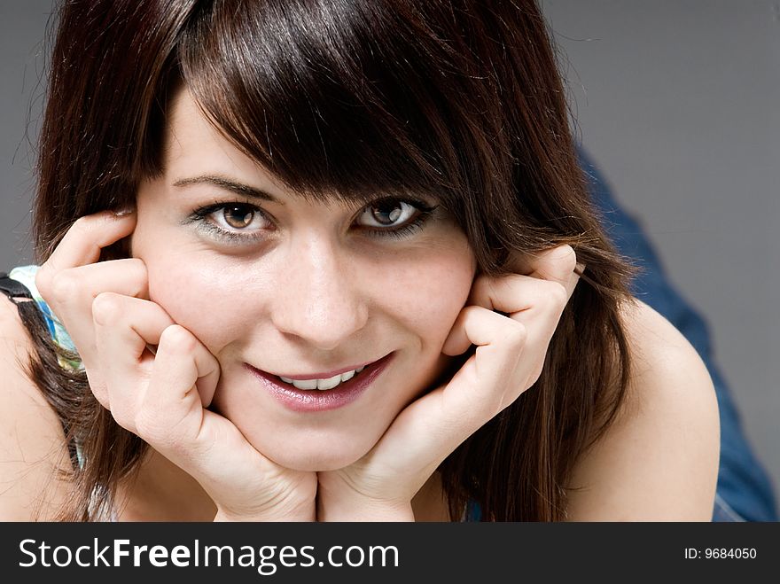 Young brunette girl smiling and looking to camera. Young brunette girl smiling and looking to camera