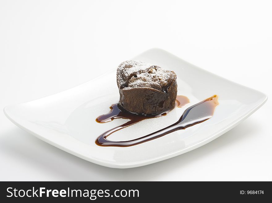 Delicious chocolate cake and caramel isolated over white