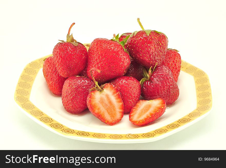 Strawberry in a plate on a white background