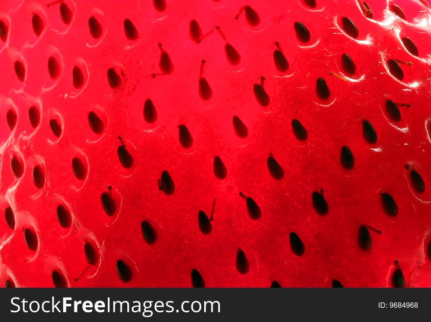 A close up view of strawberry seeds.