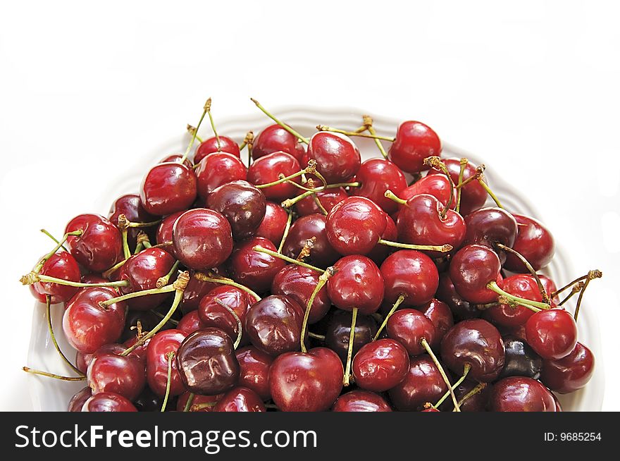 Plate of sweet cherries. Summer's theme.