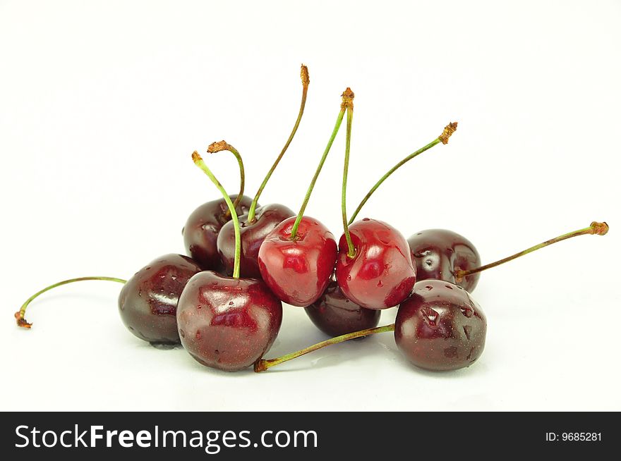 Handful of a sweet cherry on a white background