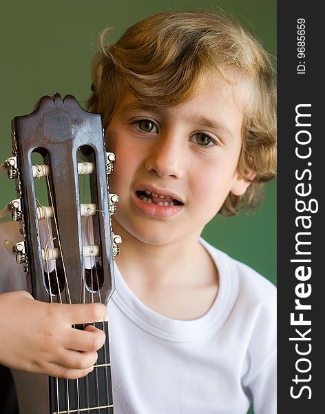 Young cute boy with guitar