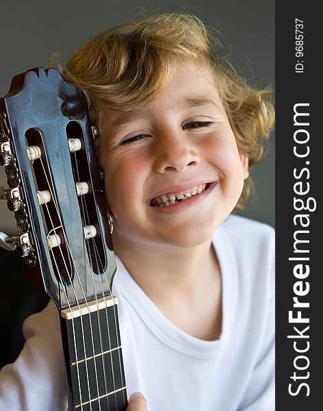 Young cute boy with guitar