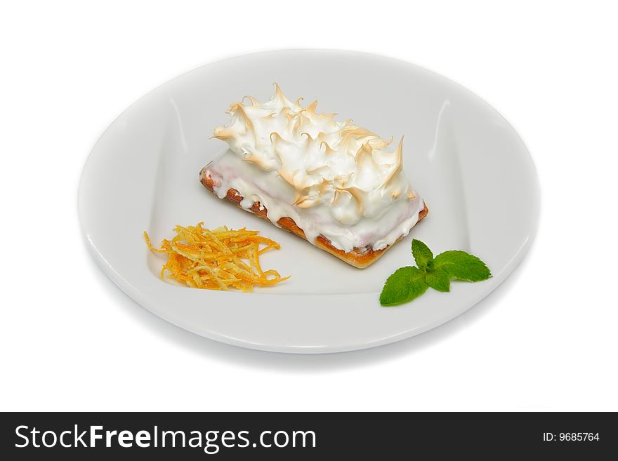 Sweet Baked Meringue Ice Cream Cake on the White Plate