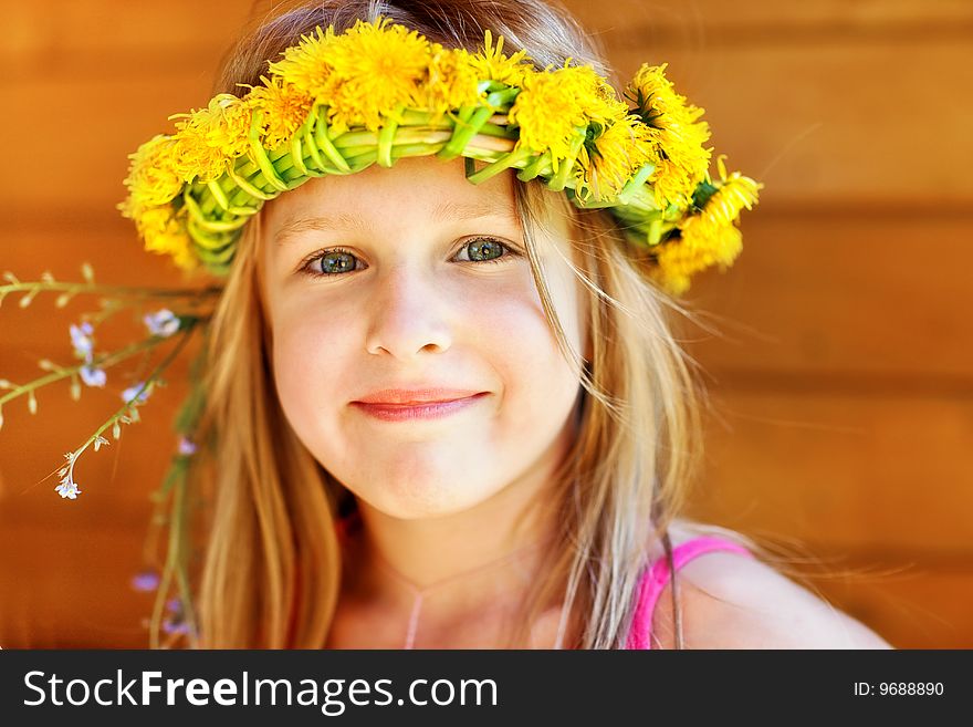 Portrait of the beautiful  girl in a wreath. Portrait of the beautiful  girl in a wreath