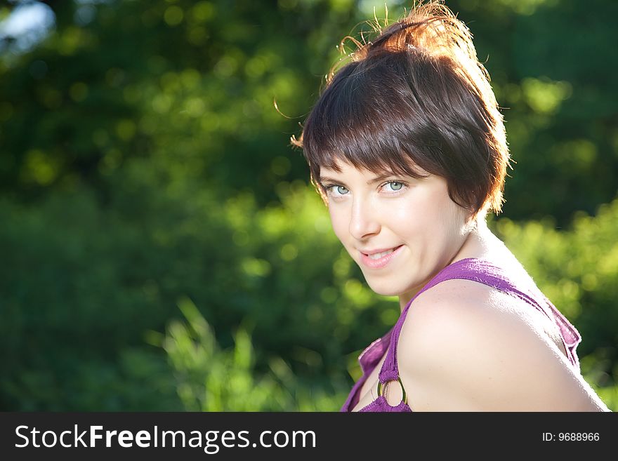 Young Pretty Woman Close-Up Portrait Outdoors