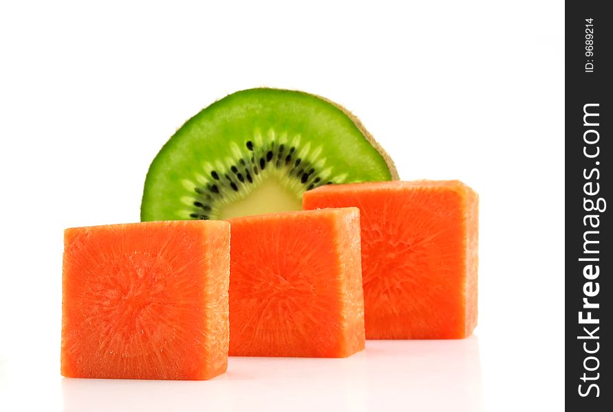 Carrot bricks and kiwi lobule isolated on a white background