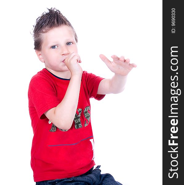 Cute blue-eyed boy posing in studio