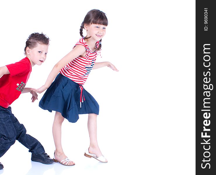 Cute blue-eyed children posing in studio