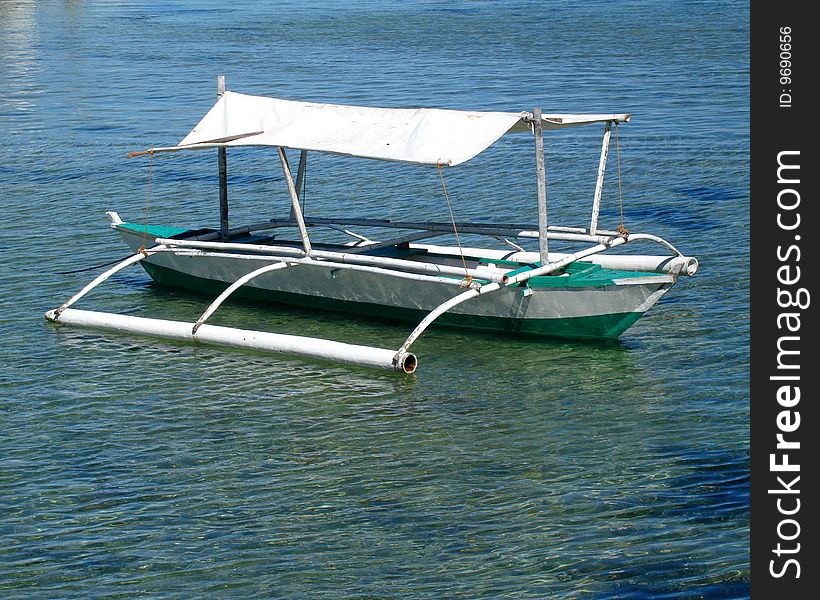 A small fishing bunker against a blue green sea