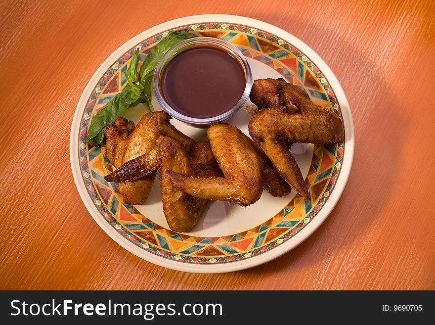 Roasted chicken wings, closeup studio shot