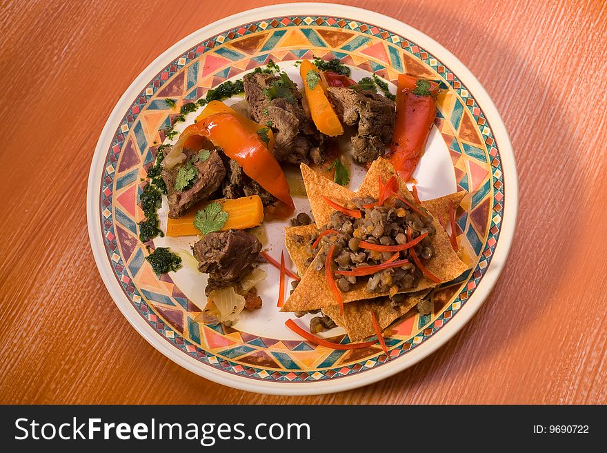 Mexican meat with peas, closeup studio shot