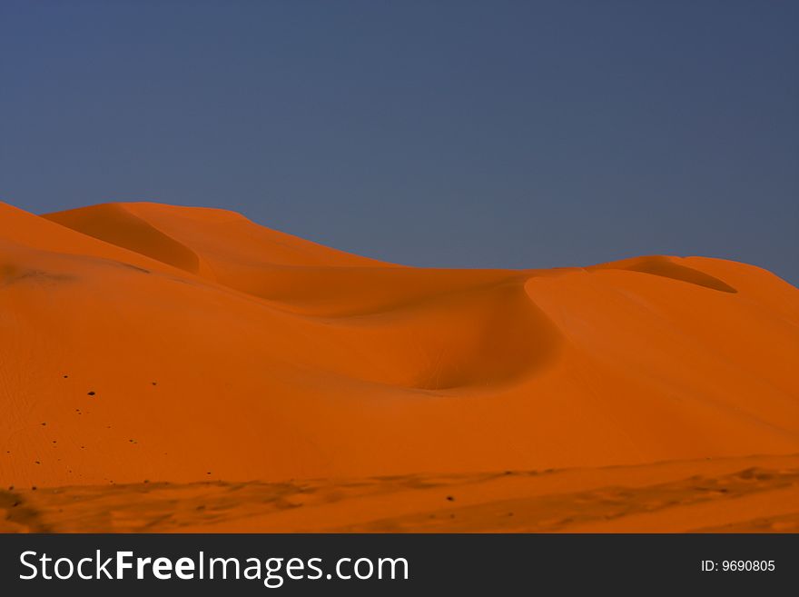 Orange sand of desert at evening