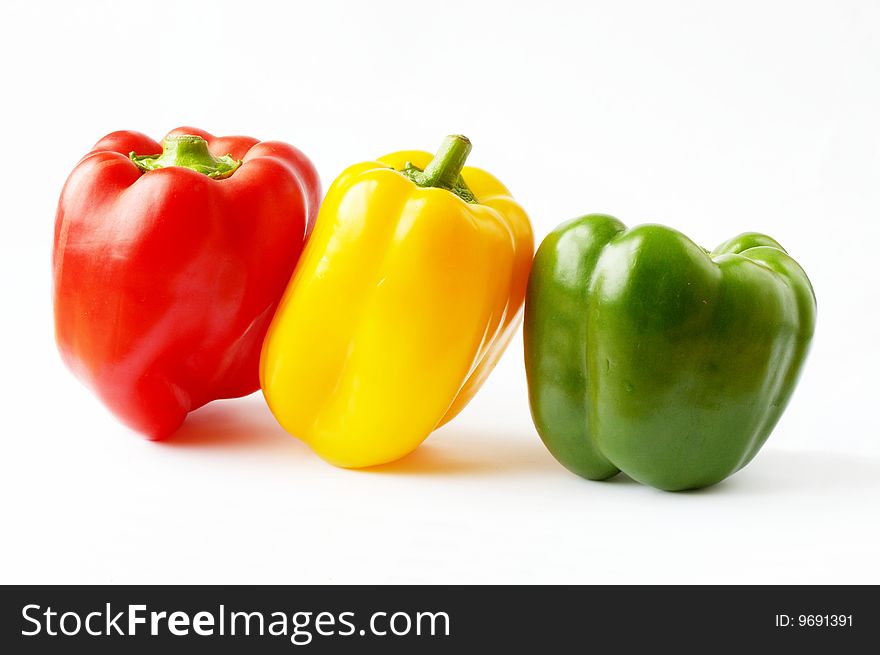 Tree bell peppers on a white background