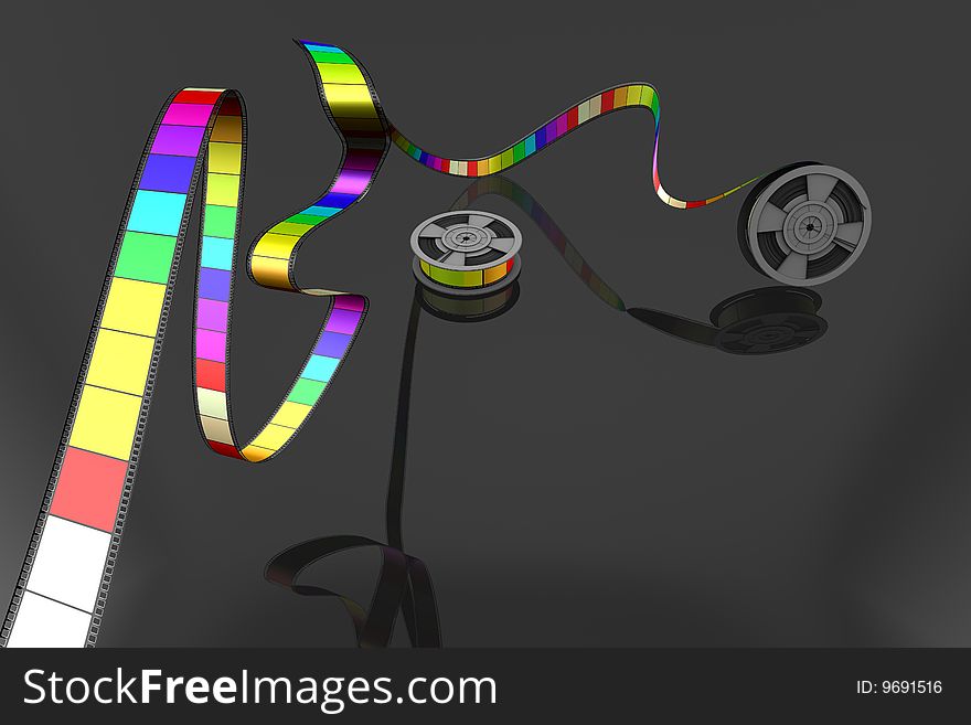 Two Film reels on black background unrolled in various bright colors. Two Film reels on black background unrolled in various bright colors