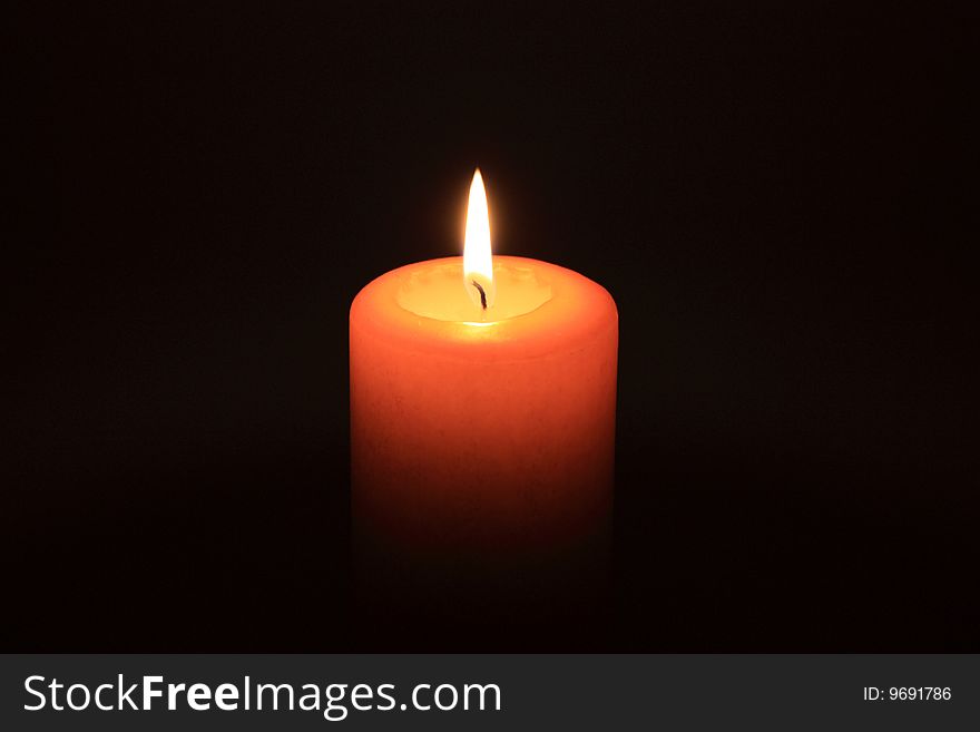 Glowing wax candle in the dead of the nights. Glowing wax candle in the dead of the nights