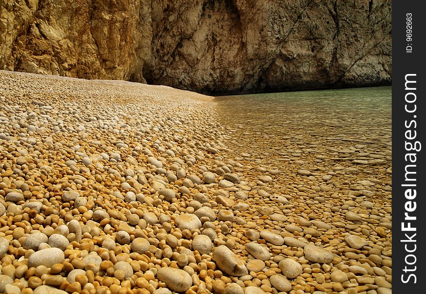 golden sand at the beach, north adriatic sea,perfect around stones. golden sand at the beach, north adriatic sea,perfect around stones