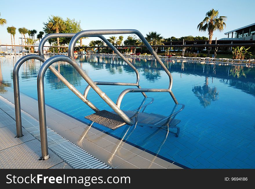 Steel hand-rails of a pool. Steel hand-rails of a pool
