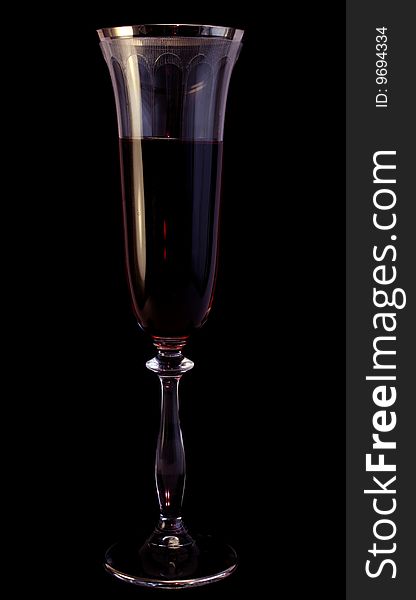 Glass with wine on a black background, dark