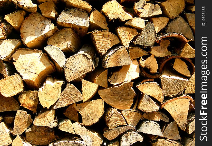 A Pile of freshly split pieces of firewood. A Pile of freshly split pieces of firewood.